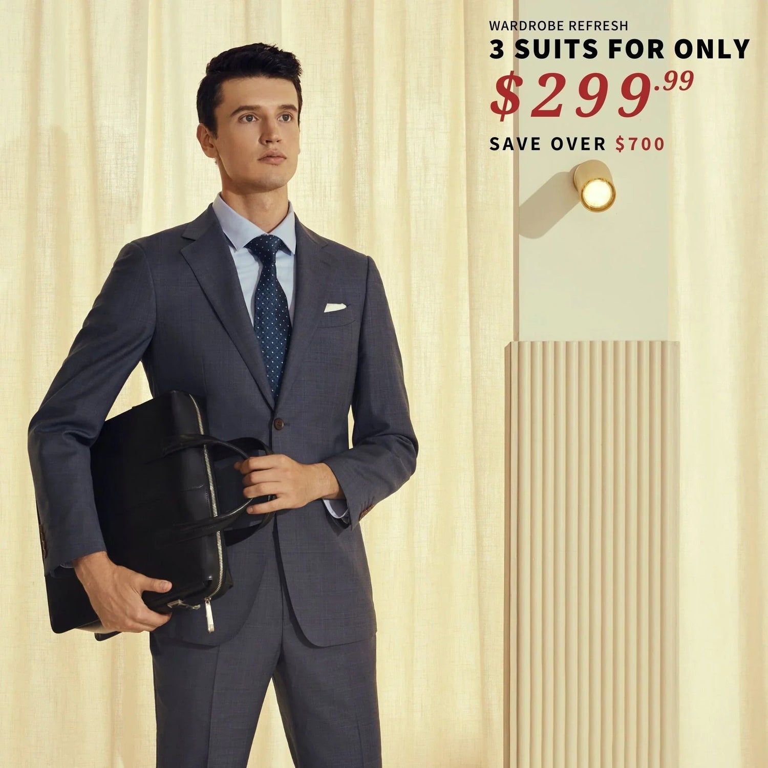 A man in a suit with unhemmed pants holding a helmet stands next to an advertisement for an online-only BYOB suit sale featuring 3 Suits for $299.