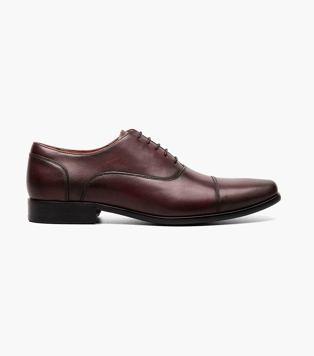 Florsheim Wine Cap Toe Oxford Shoes provide all-day comfort with a cap toe on a white background.