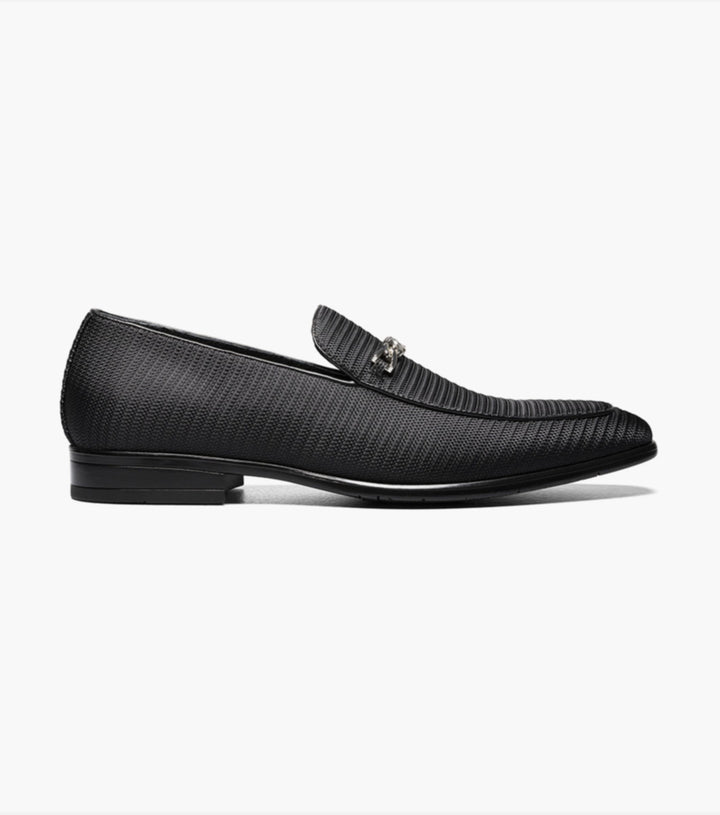 An elegant Stacy Adams Black Tazio Moc Toe Bit Slip-on Shoes adorned with a stylish metal buckle.