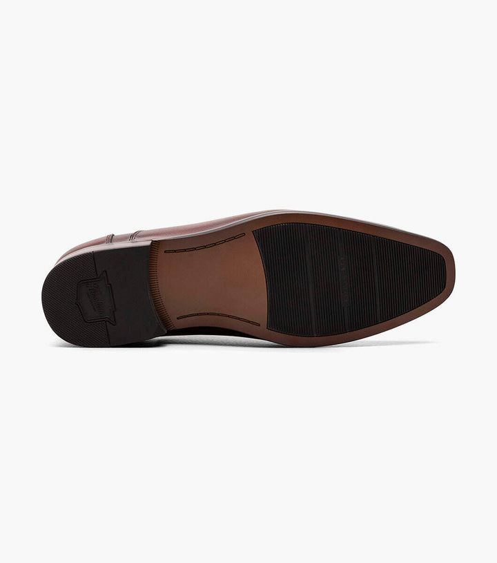 A pair of brown Florsheim Wine cap toe oxford shoes with all-day comfort, featuring black soles on a white background.