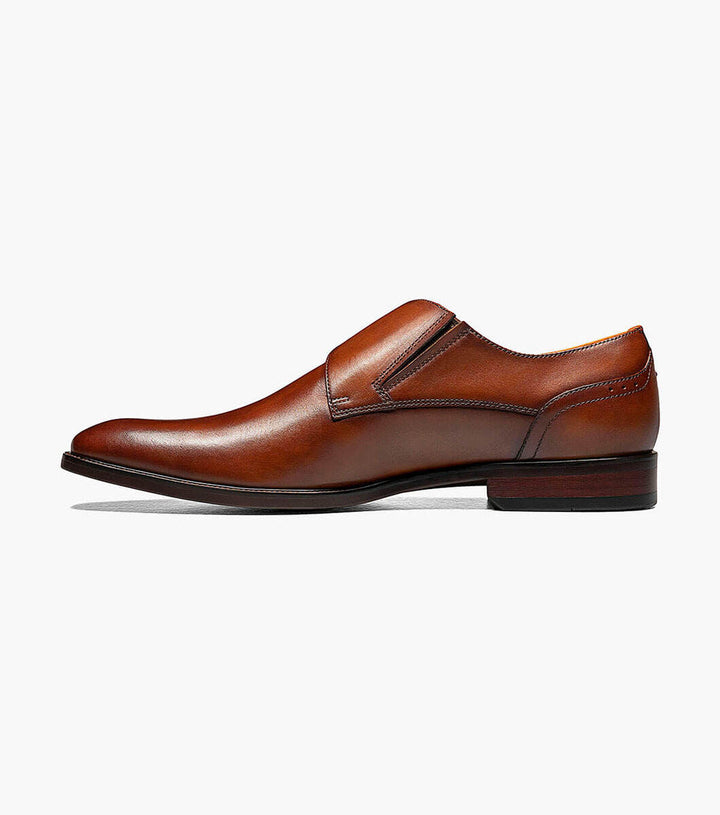 A Florsheim Cognac Plain Toe Single Monk Strap Shoe with a buckle and rubber sole.