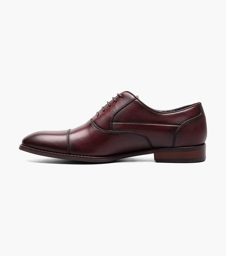 A Stacy Adams Burgundy Kallum Cap Toe Oxford shoe with a burnished leather upper.