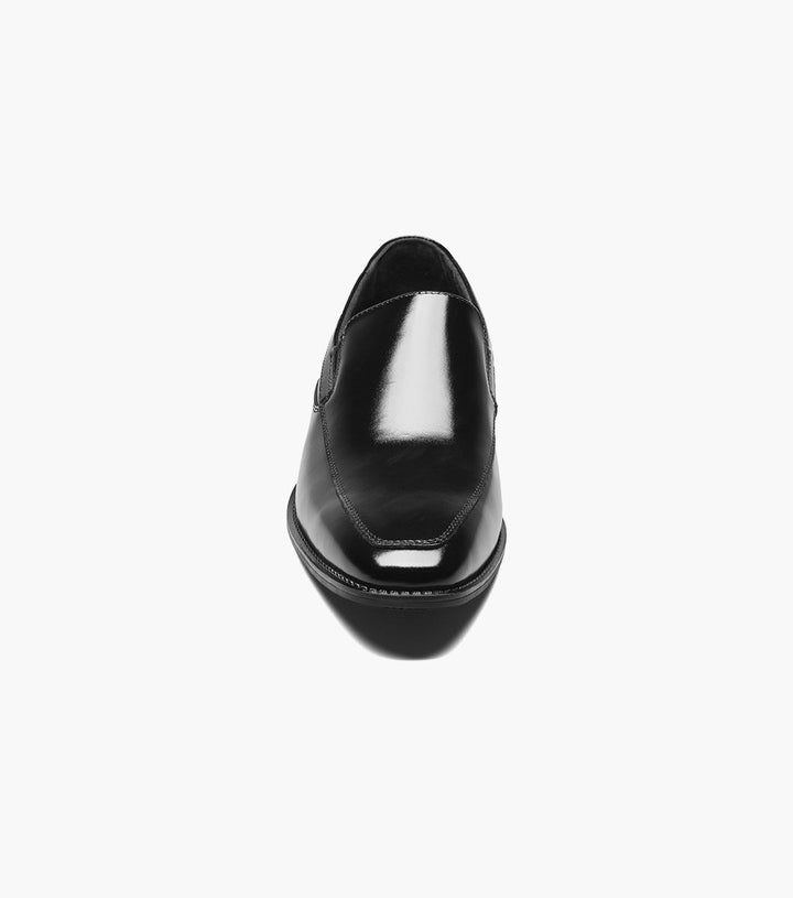 A Stacy Adams Black Aldrich Moc Toe Slip On Shoes with clean lines on a white background.