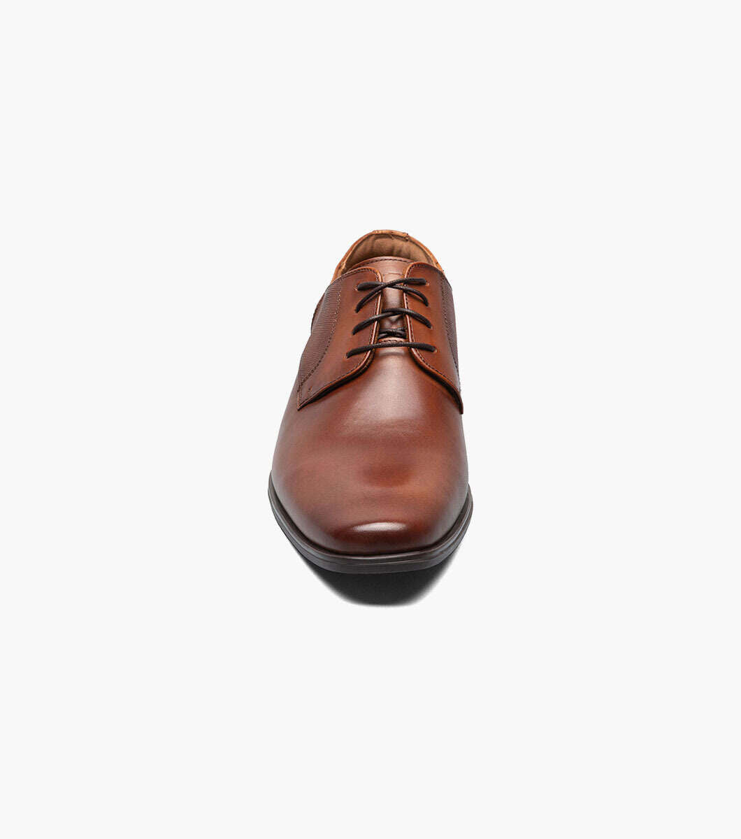A Florsheim Plain Toe Oxford Cognac shoe on a white background.