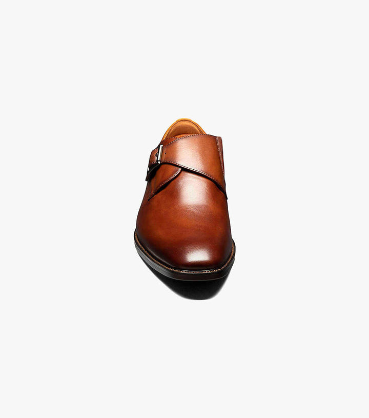 A brown Florsheim Cognac Plain Toe Single Monk Strap Shoe with a leather upper on a white background.