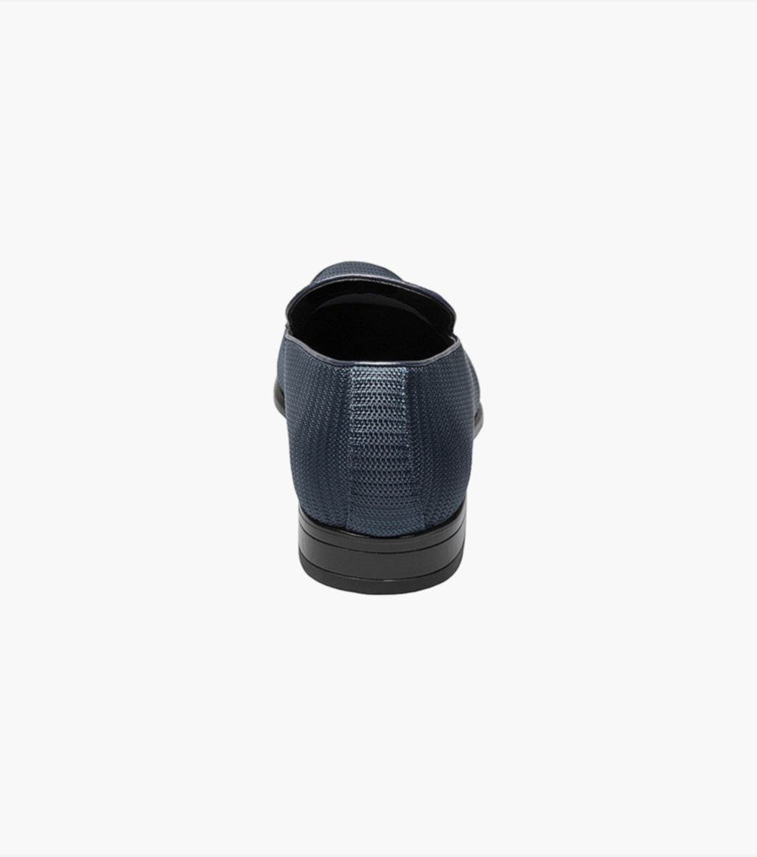 A pair of Stacy Adams Navy Tazio Moc Toe Bit Slip-on Shoes, featuring memory foam on a white background.