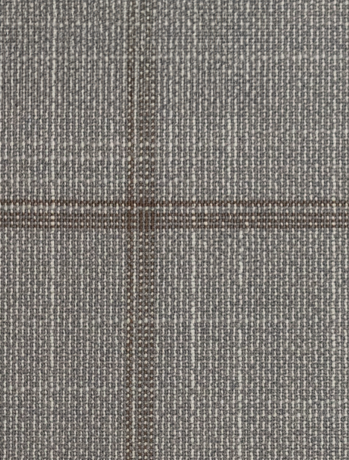 A close-up of the FUBU Oat Grey with Brown Windowpane Peak Lapel 2-Piece Suit by Fubu The Colle showcases a refined gray woven fabric with a subtle checkered pattern, perfect for a Slim Fit suit, featuring intersecting dark and light threads made of Tetron Rayon.