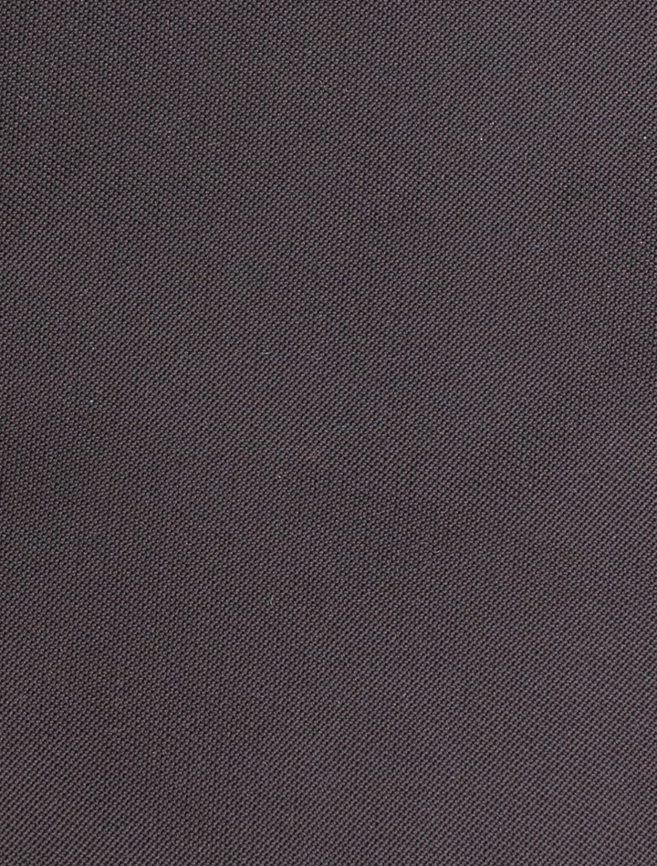 Close-up of the FUBU Charcoal with Purple Windowpane Vested Suit by Fubu The Colle, showcasing its finely woven dark gray fabric, ideal for crafting a modern fit suit.