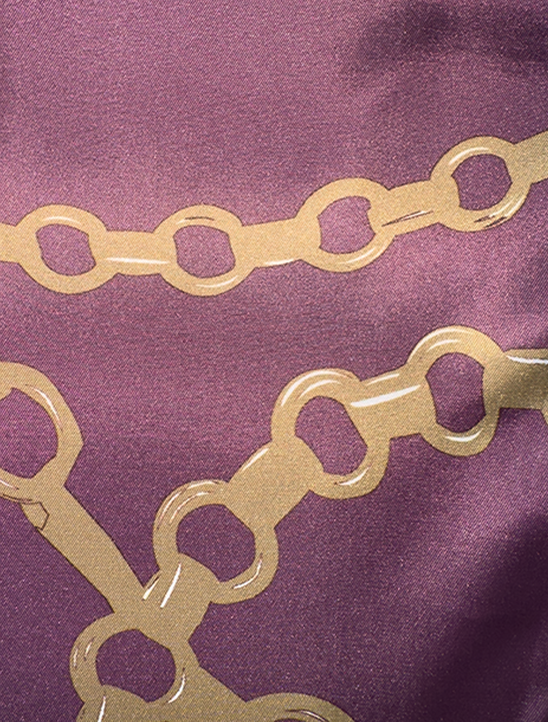 Close-up of the FUBU Tan with Maroon Windowpane Vested Suit by Fubu The Colle, showcasing a modern fit that enhances style and comfort with a purple background and gold chain pattern.