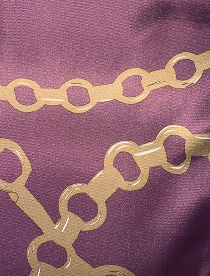 Close-up of the FUBU Tan with Maroon Windowpane Vested Suit by Fubu The Colle, showcasing a modern fit that enhances style and comfort with a purple background and gold chain pattern.
