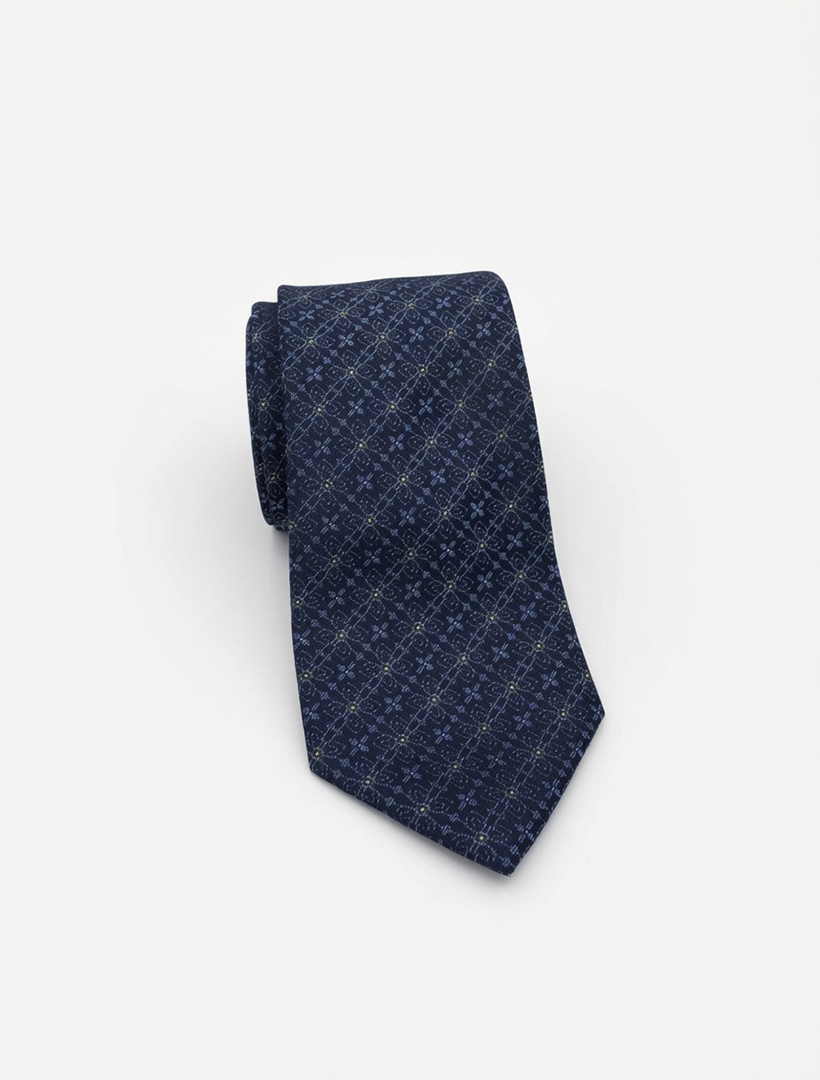 Karako Collecti Navy and Green Floral Patterned Microfiber Tie, shown rolled up on a plain white background—an elegant choice for wedding attire or as an essential men’s suit accessory.