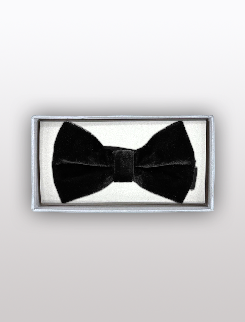 The Men's Black Velvet Bowtie by Ckl, featuring an adjustable fit, is elegantly presented in a rectangular box on a white background.