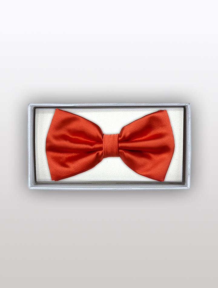 The Karako Collecti Mens Adjustable Pre-Tied Satin Bowtie in Red, elegantly crafted from satin polyester, comes neatly packaged in a white rectangular box, making it perfect for any formal occasion.