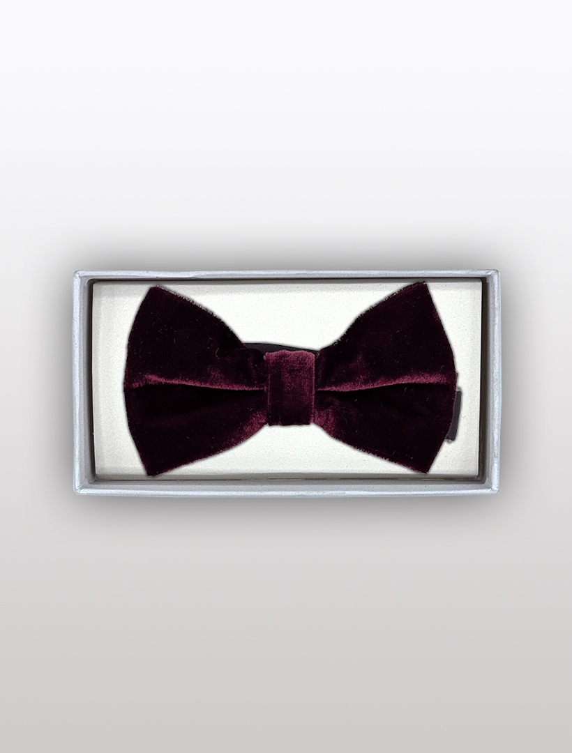 The Men's Burgundy Velvet Bowtie by Ckl, known for its adjustable fit and elegant design, is beautifully presented in a rectangular box with a white background.