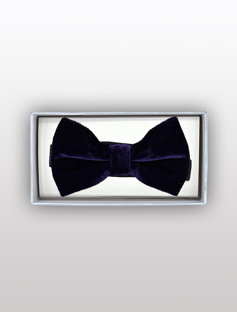 A sophisticated Men's Purple Velvet Bowtie by Ckl with an adjustable fit is showcased in a rectangular silver box.