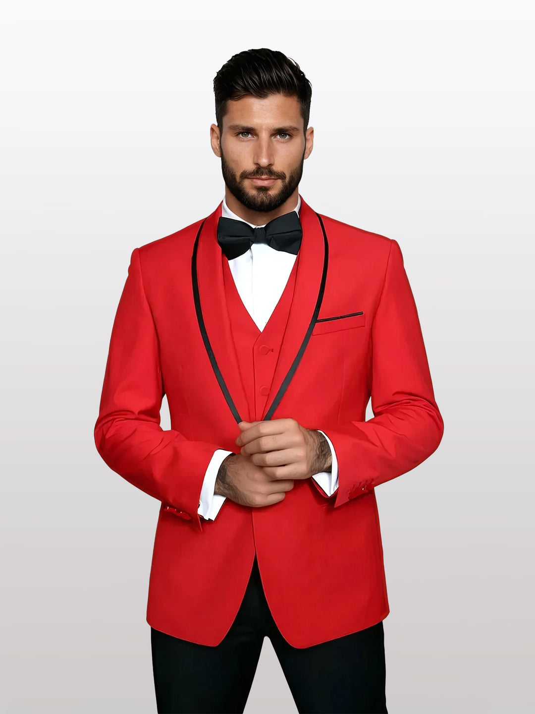 A man strikes a confident pose, wearing a Statement Men's Red Vested Tuxedo with Black Trim Fine Lapel, made from 100% wool, complemented by a black bow tie.