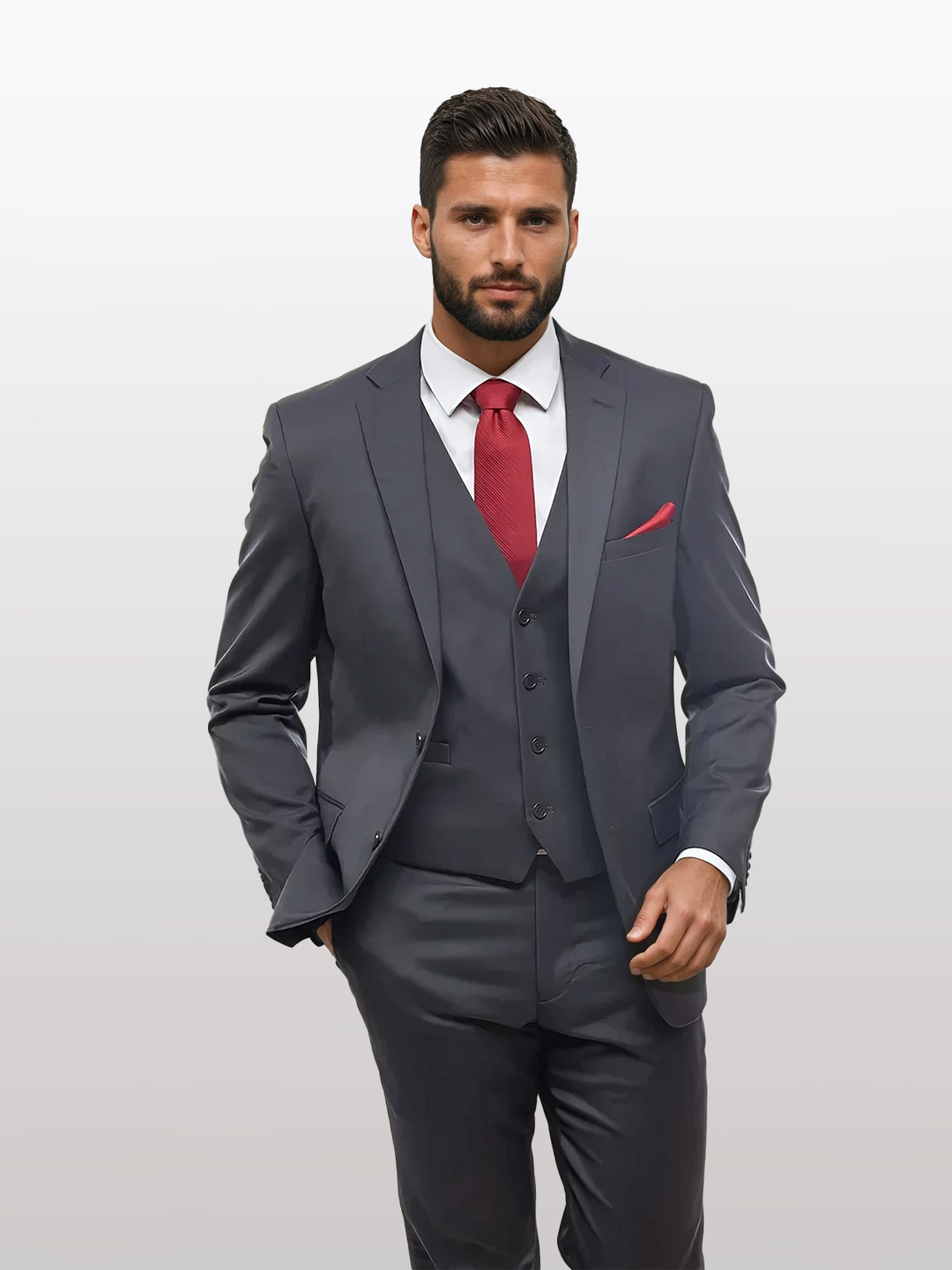 A man wears the Charcoal Grey Men's Slim-Fit Suit Separates Jacket by Karako Separate with a white shirt, red tie, and red pocket square, standing against a plain light background.