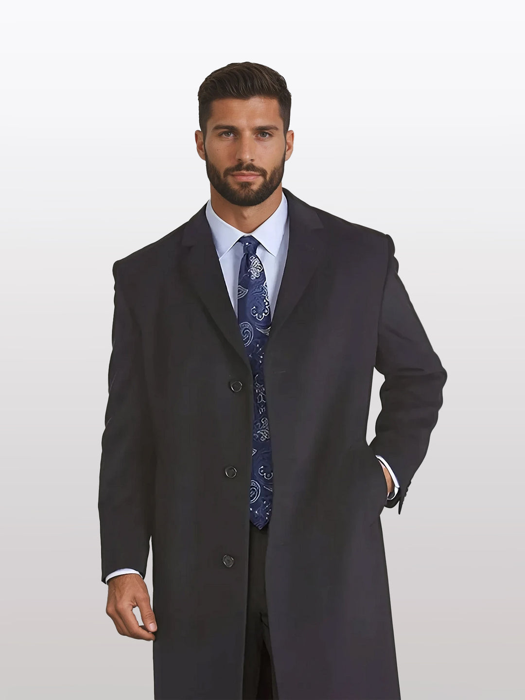 A man with short dark hair is wearing Mallard's Men's Charcoal Wool Winter Coat - 45" Length Overcoat and a patterned tie, standing against a light background.