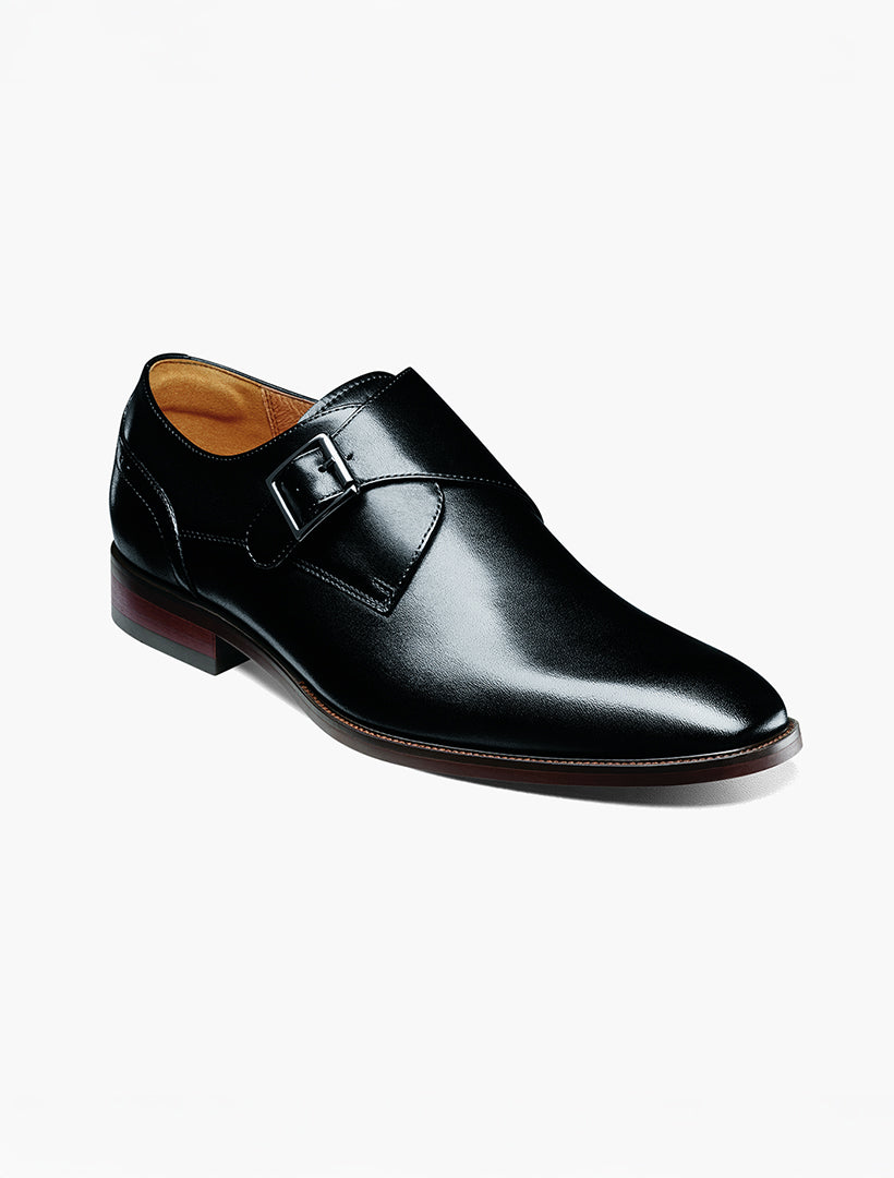 The Florsheim Black Plain Toe Single Monk Strap Shoe by Florsheim features a leather upper, low heel, brown sole, Flexsole technology, and a monk strap with buckle, shown singly on a white background.