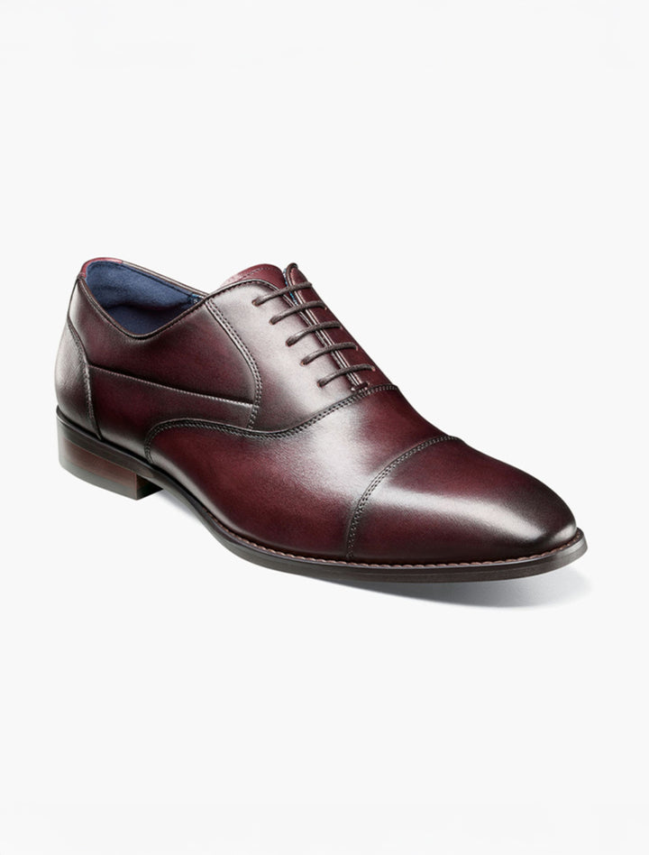 A single Stacy Adams Burgundy Kallum Cap Toe Oxford shoe, featuring closed lacing, burnished leather finish, and low heel, is displayed on a white background.