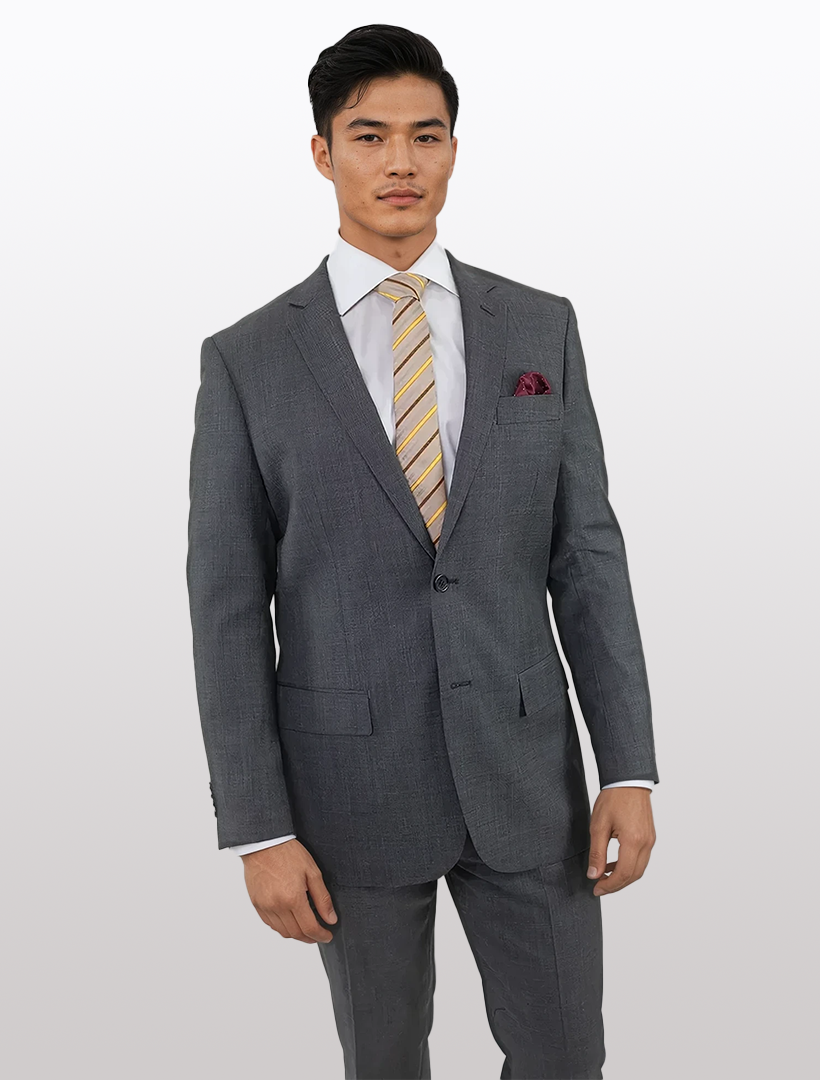 A man wearing the Men's Grey Graph Check Slim Fit Wool Suit by Karako & Sons, paired with a yellow-striped tie and maroon pocket square, stands against a plain background.