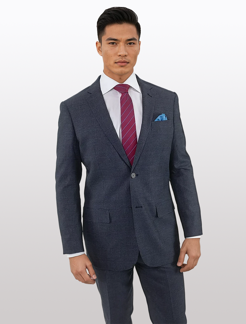 A person wearing Karako & Sons' Men's Blue Glen Check Slim Fit Wool Suit with a white shirt and red striped tie stands against a plain backdrop.