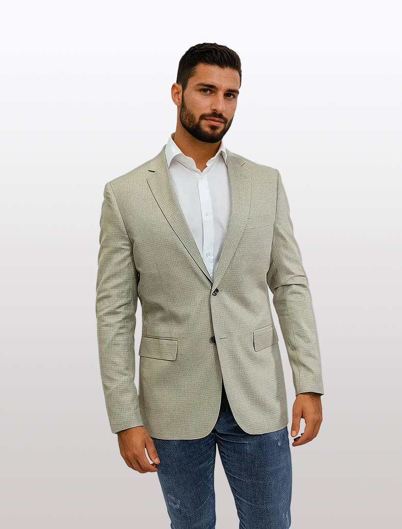 A person poses stylishly against a plain background in the FUBU Slim Fit Beige Graph Check Sport Jacket by Fubu The Colle.