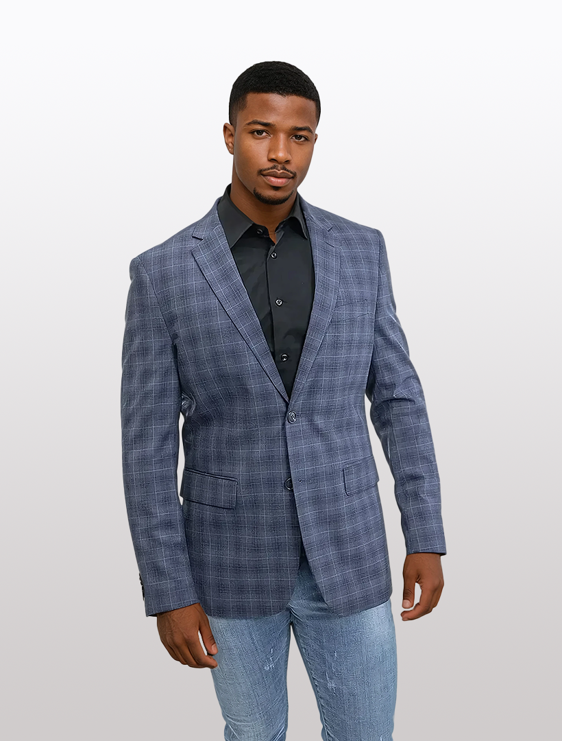 Man in a sleek FUBU Slim Fit Medium Blue Graphic Sport Jacket, black shirt, and jeans standing against a plain background.