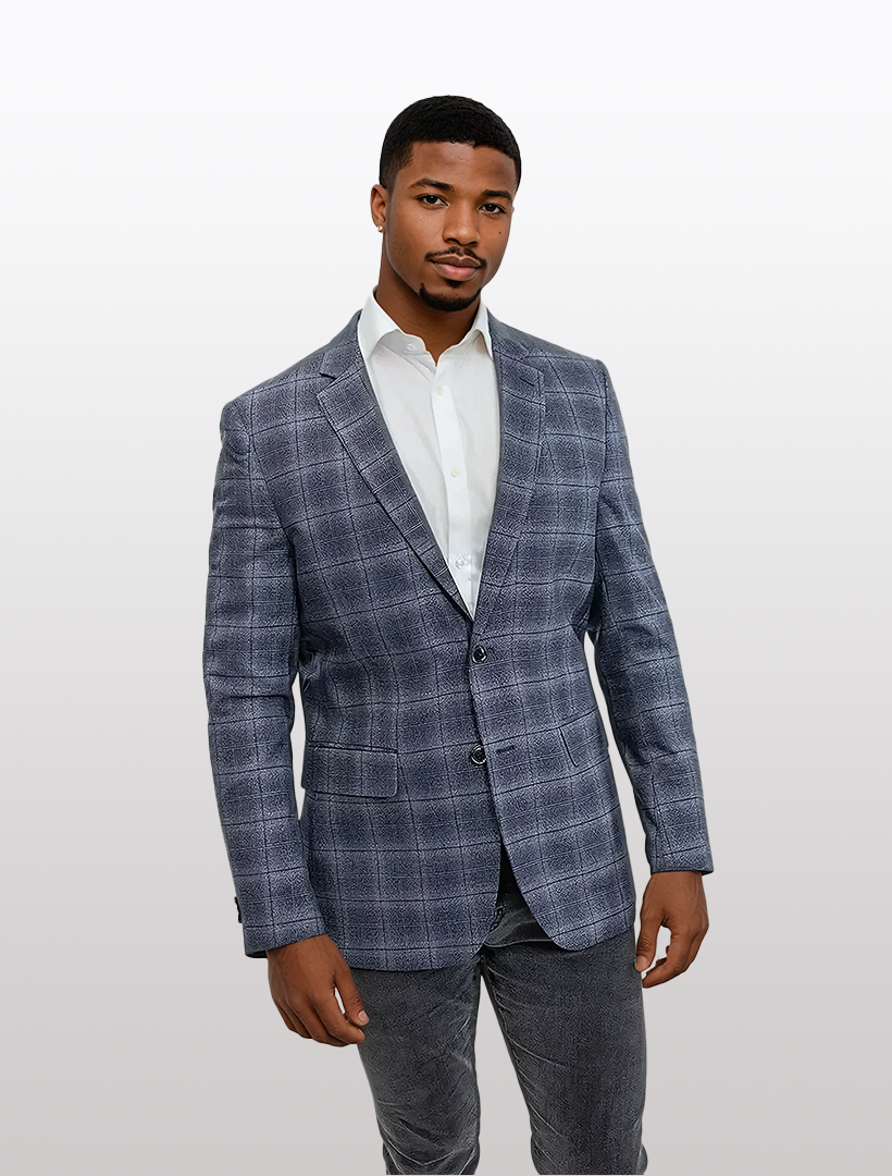 A person wearing a FUBU Slim Fit Charcoal Graphic Sport Jacket, white shirt, and dark jeans stands against a light gray background.