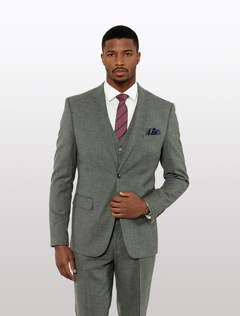 A man in a slim fit FUBU Grey with Blue & White Pinstripe Windowpane Vested Suit by Fubu The Colle, paired with a white shirt and striped tie, stands against a plain background.