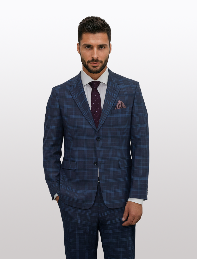 A man wearing the Gianco Ferro Men's Charcoal with Navy Pattern Slim Fit Suit stands against a plain light background, paired with a white shirt, purple patterned tie, and pocket square.