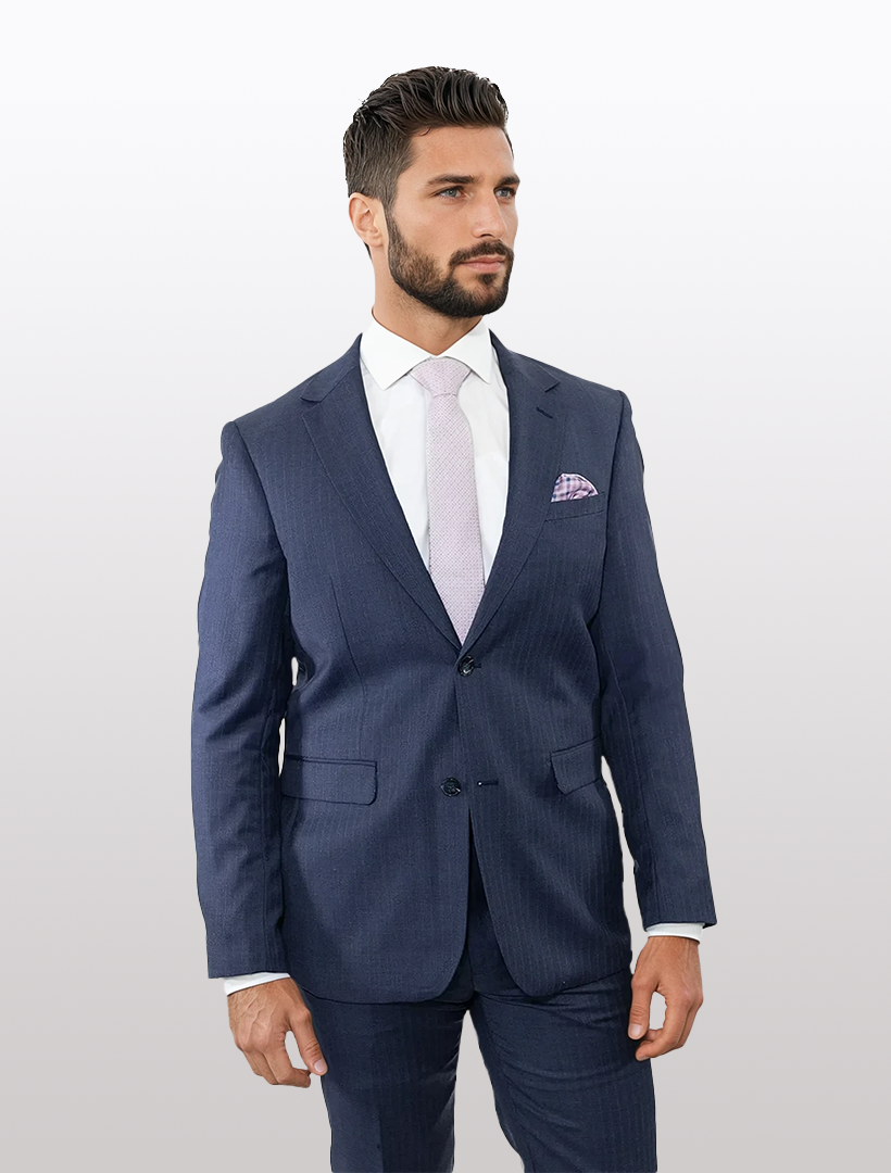 A man wearing a Douglas Grahame Men's Blue Double Stripe Wool Slim Fit Suit, paired with a light purple tie and pocket square, stands against a plain white background.