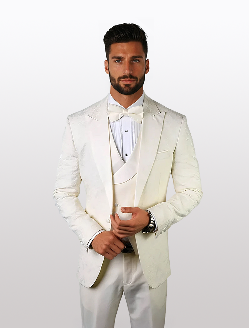 Man wearing a Statement Men's Off White Patterned Vested Tuxedo with a bow tie, standing against a plain background.