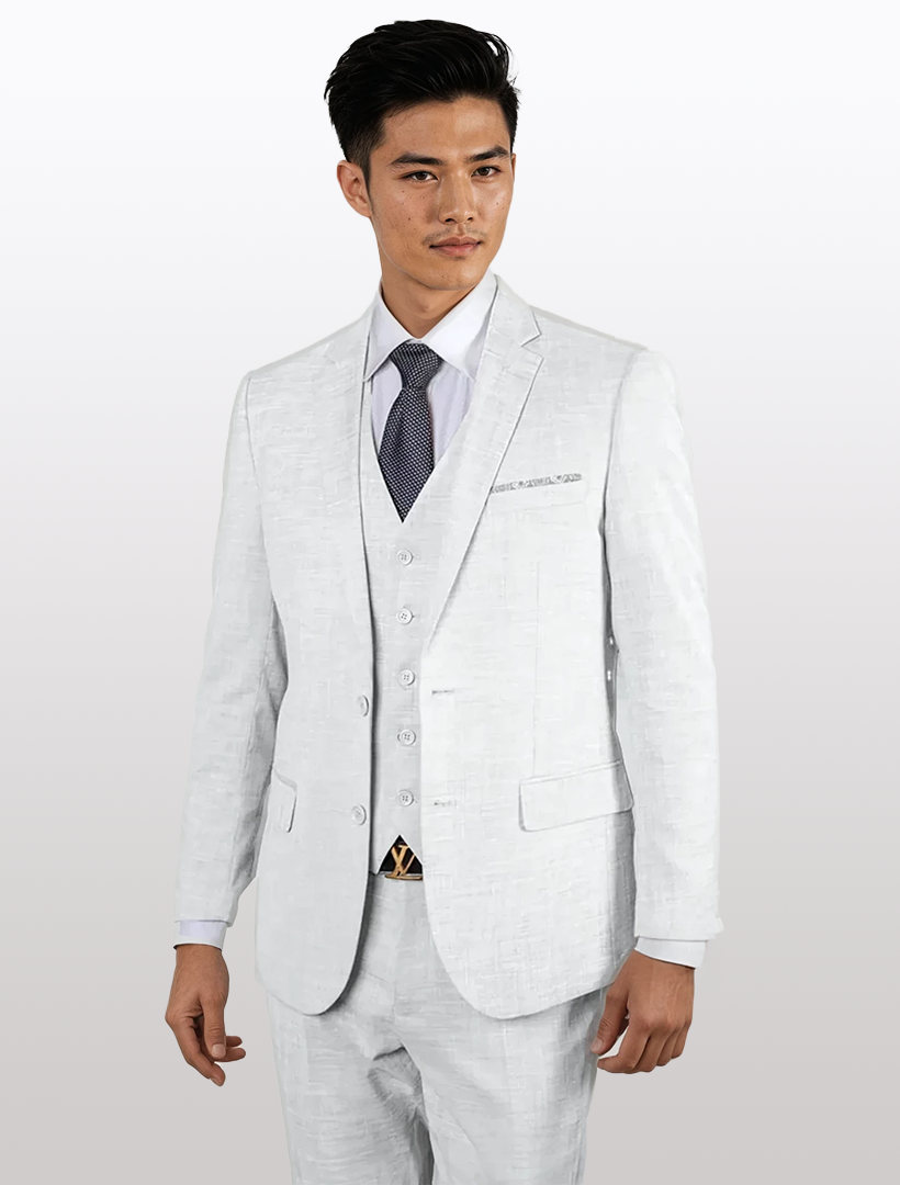 A man in a Statement Men's White 100% Wool Slim Fit Vested Suit, styled with a white dress shirt and gray tie, stands against a plain background.