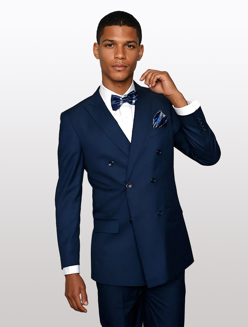 A man in a modern fit Statement Men's Sapphire Blue Suit, made from 100% wool, wears a bow tie while standing against a plain white background.