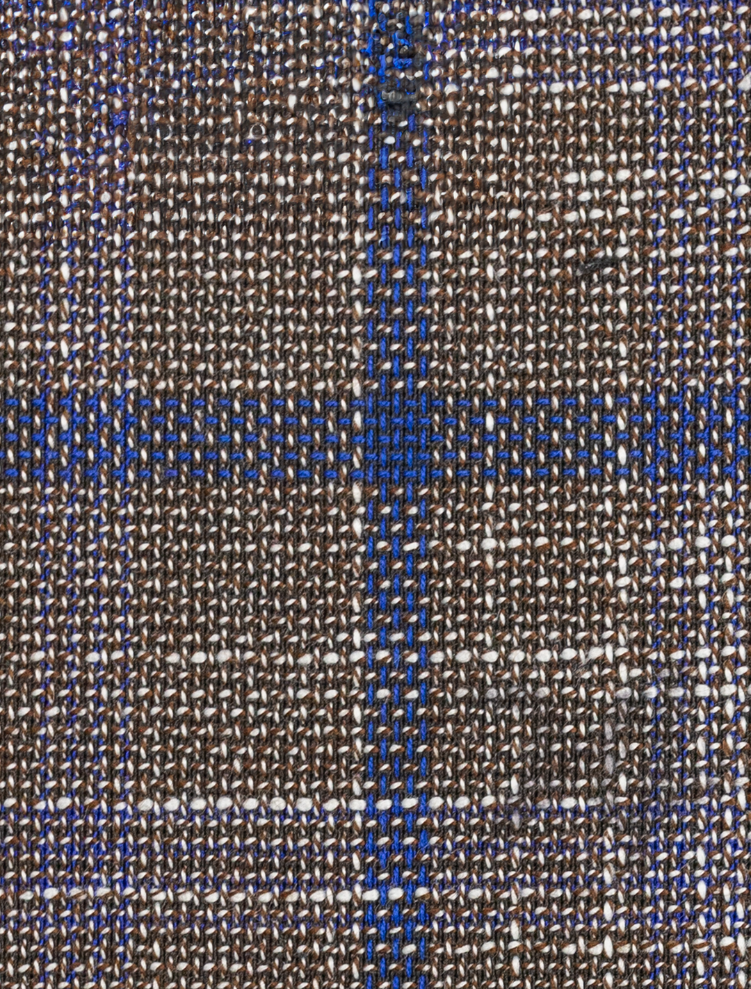 Close-up of a woven fabric from the FUBU Cedar Brown with Royal Blue Windowpane Sport Jacket by Fubu The Colle, featuring a sophisticated plaid pattern reminiscent of classic sport coat textiles.