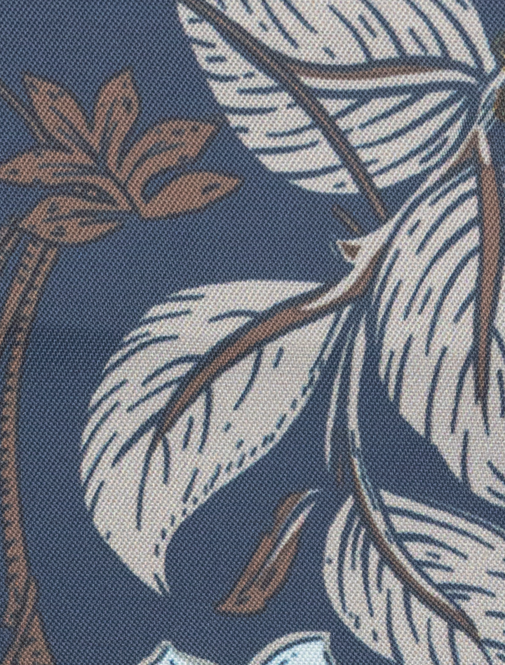 The FUBU Cedar Brown with Royal Blue Windowpane Sport Jacket by Fubu The Colle features a pattern of white and brown leaves and branches on a blue background, ideal for crafting.