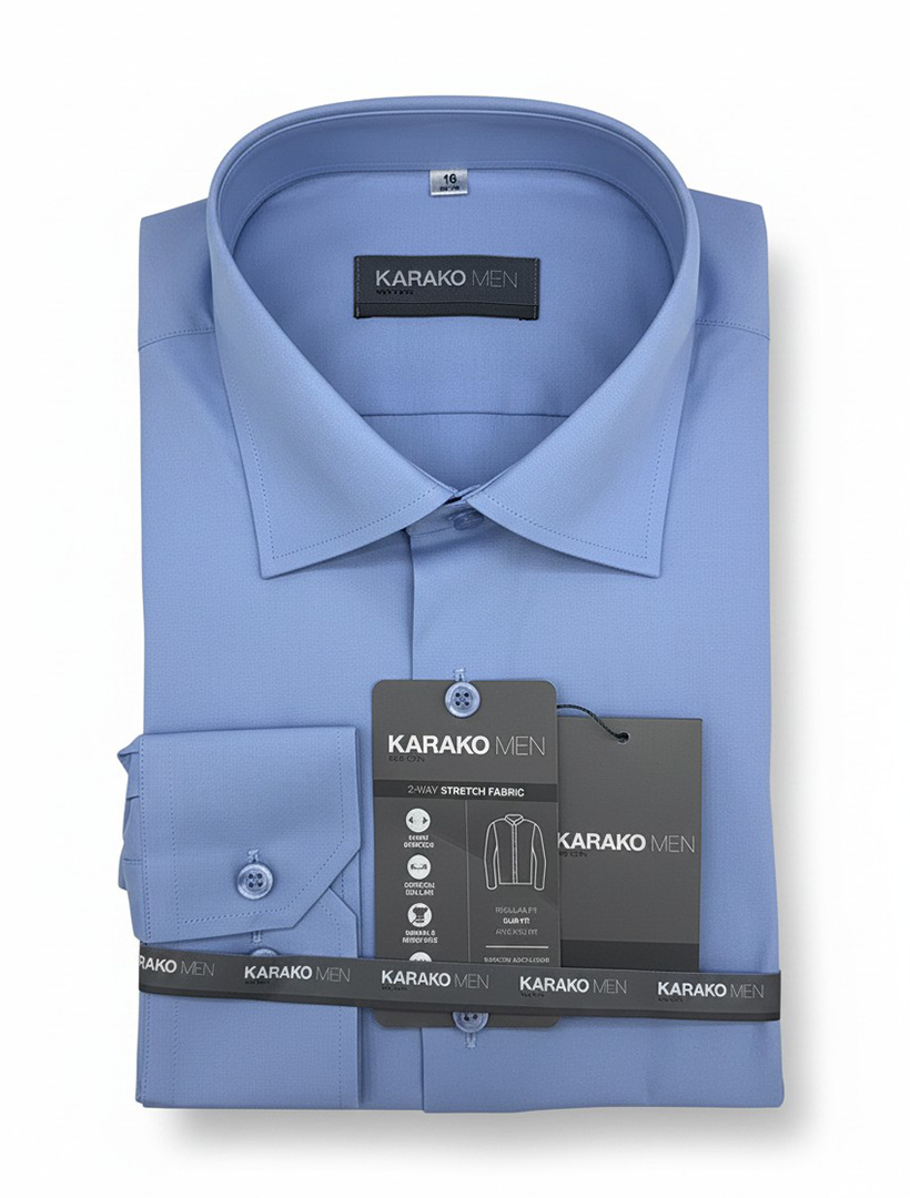 A neatly folded Karako Men Light Blue Dress Shirt, slim-fit with tags and original packaging, is displayed against a white background.
