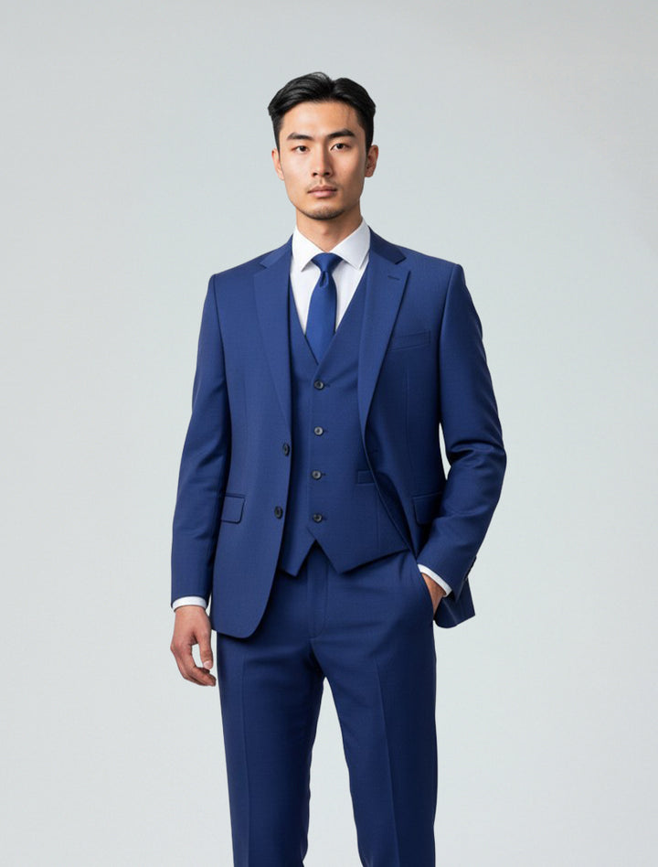 A man stands facing forward in the Blue Men&