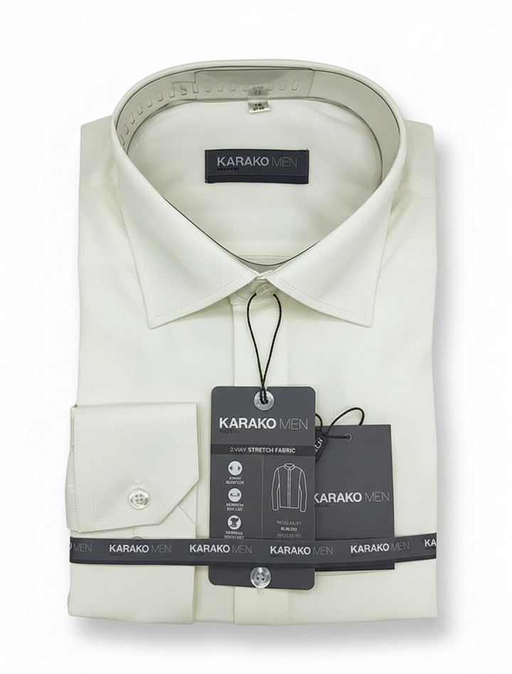 Folded Karako Men Bone Dress Shirt with tags labeled "KARAKO MEN," featuring a classic collar and single-button cuff, displayed against a white background. This men&