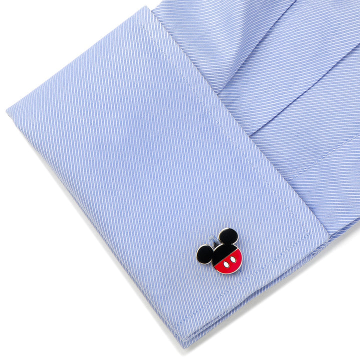 Disney Mickey Mouse Pants Cufflinks shaped like Mickey Mouse pants attached to a light blue dress shirt cuff, adding a touch of Disney to your accessories.