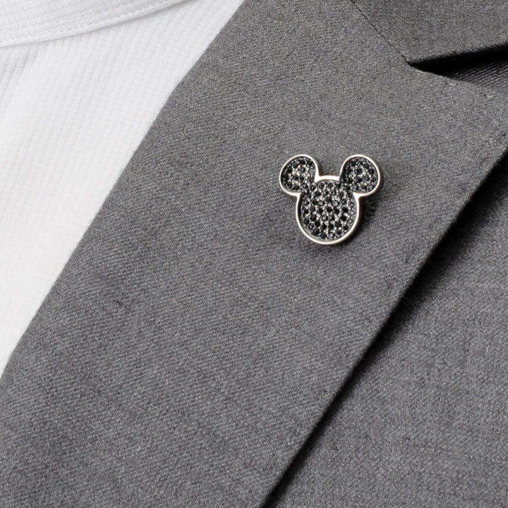 Disney Mickey Mouse Black Pave Crystal Lapel Pin filled with black pave crystals pinned to a gray suit lapel.
