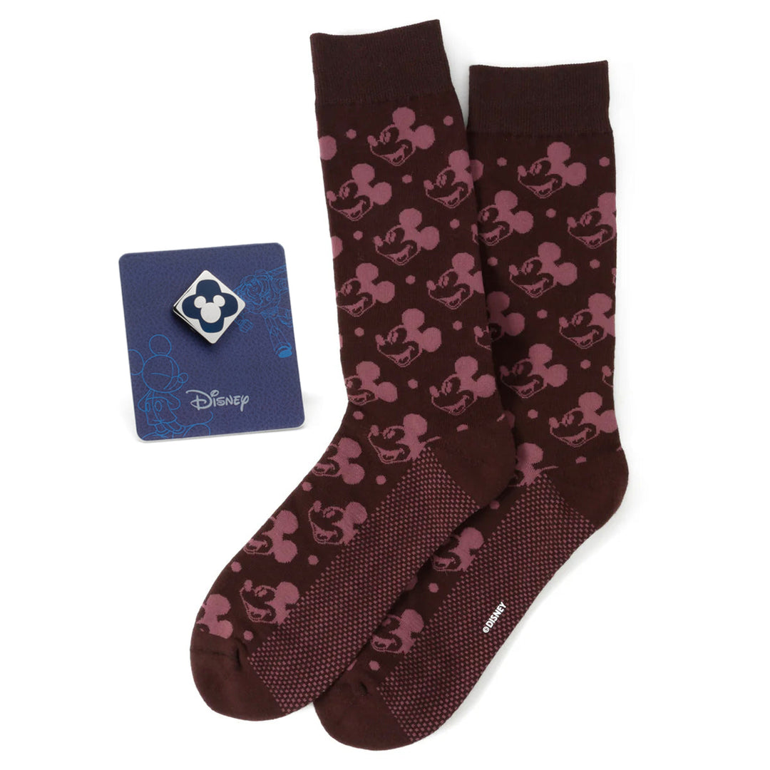 Disney Mickey Mouse Red Dot Socks and Blue Lapel Pin Gift Set featuring a pair of dark red socks with a repeating Mickey Mouse silhouette pattern and a square lapel pin with a four-leaf clover design.