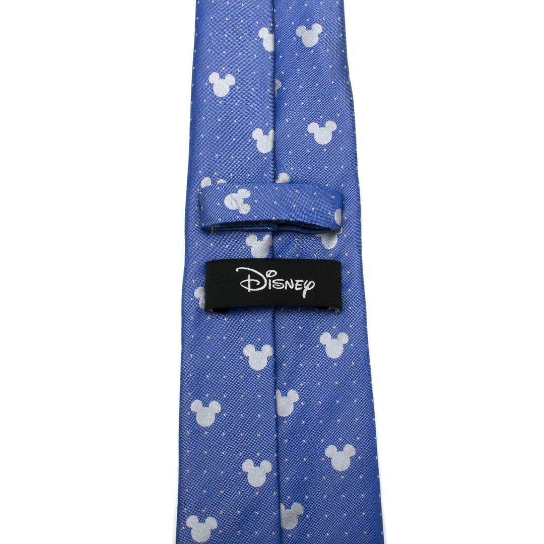 Disney Mickey Mouse Blue Pin Dot Men’s Tie in blue silk with a repeating pattern of white silhouettes and tiny dots, featuring a black Disney label on the back.