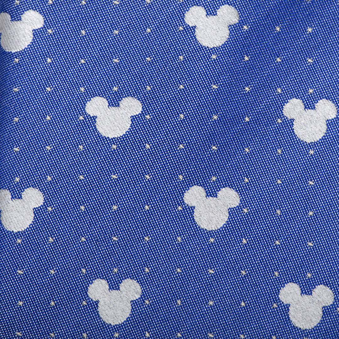Disney Mickey Mouse Blue Pin Dot Men’s Tie in blue silk with a pattern of white Mickey Mouse silhouettes and small white dots.