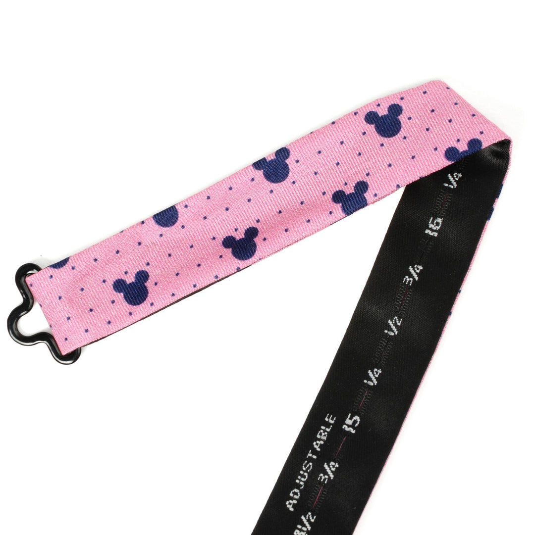 Disney Mickey Mouse Pink Dot Silhouette Pre-Tied Bow Tie with an adjustable strap, blue silhouette and dot pattern, and a black underside with size markings.