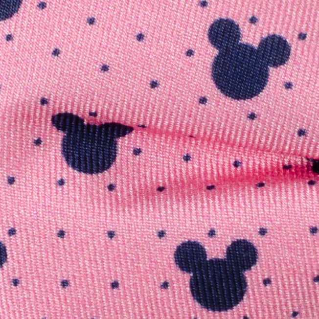 Disney Mickey Mouse Pink Dot Silhouette Pre-Tied Bow Tie in pink silk with a pattern of small dark blue dots and navy blue Mickey Mouse silhouettes.