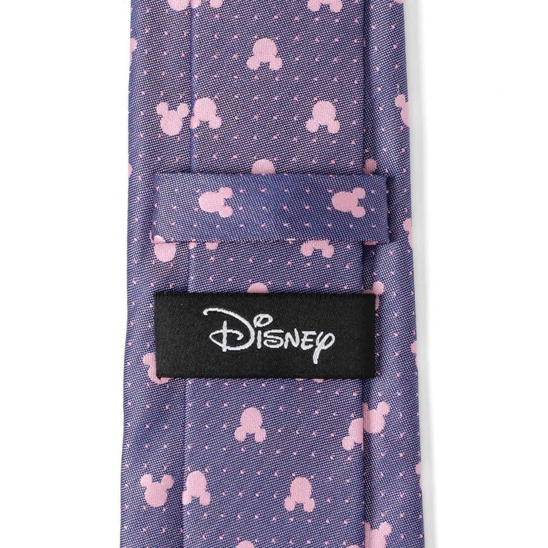 Disney Mickey Mouse Purple and Pink Dot Silhouette Tie featuring a purple background with a repeating pattern of pink silhouettes and small white dots, finished with a black Disney label on the back.