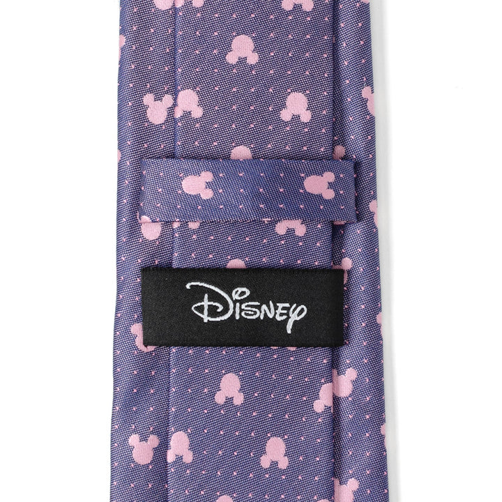 Disney Mickey Mouse Purple and Pink Dot Silhouette Tie featuring a purple background with a repeating pattern of pink silhouettes and small white dots, finished with a black Disney label on the back.