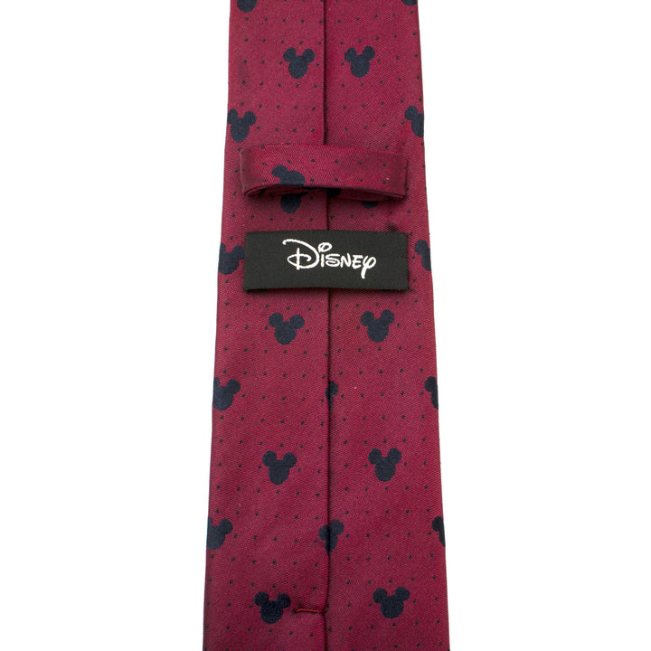Disney Mickey Mouse Red Pin Dot Men’s Tie in red silk with a pattern of dark Mickey Mouse silhouettes and small dots, featuring a black Disney label on the back.